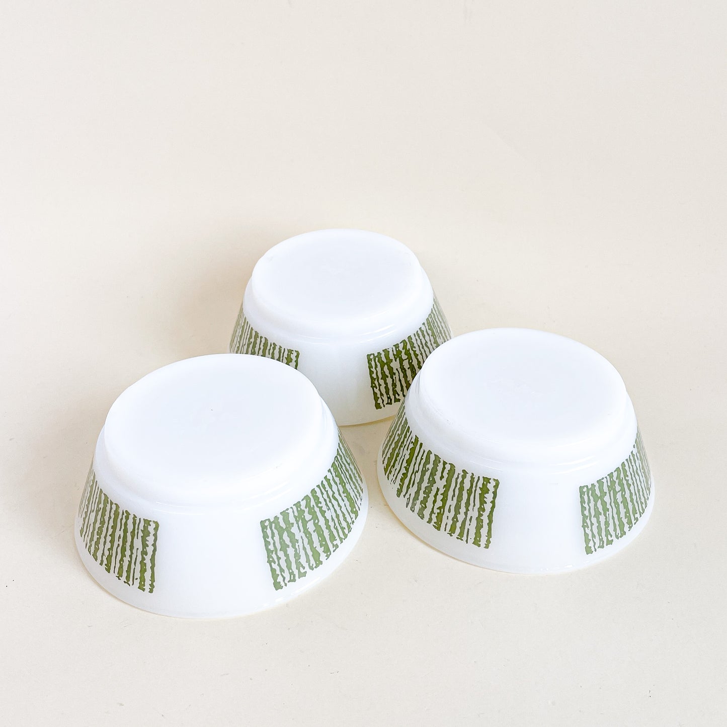 Trio of white and green Fire-King bowls