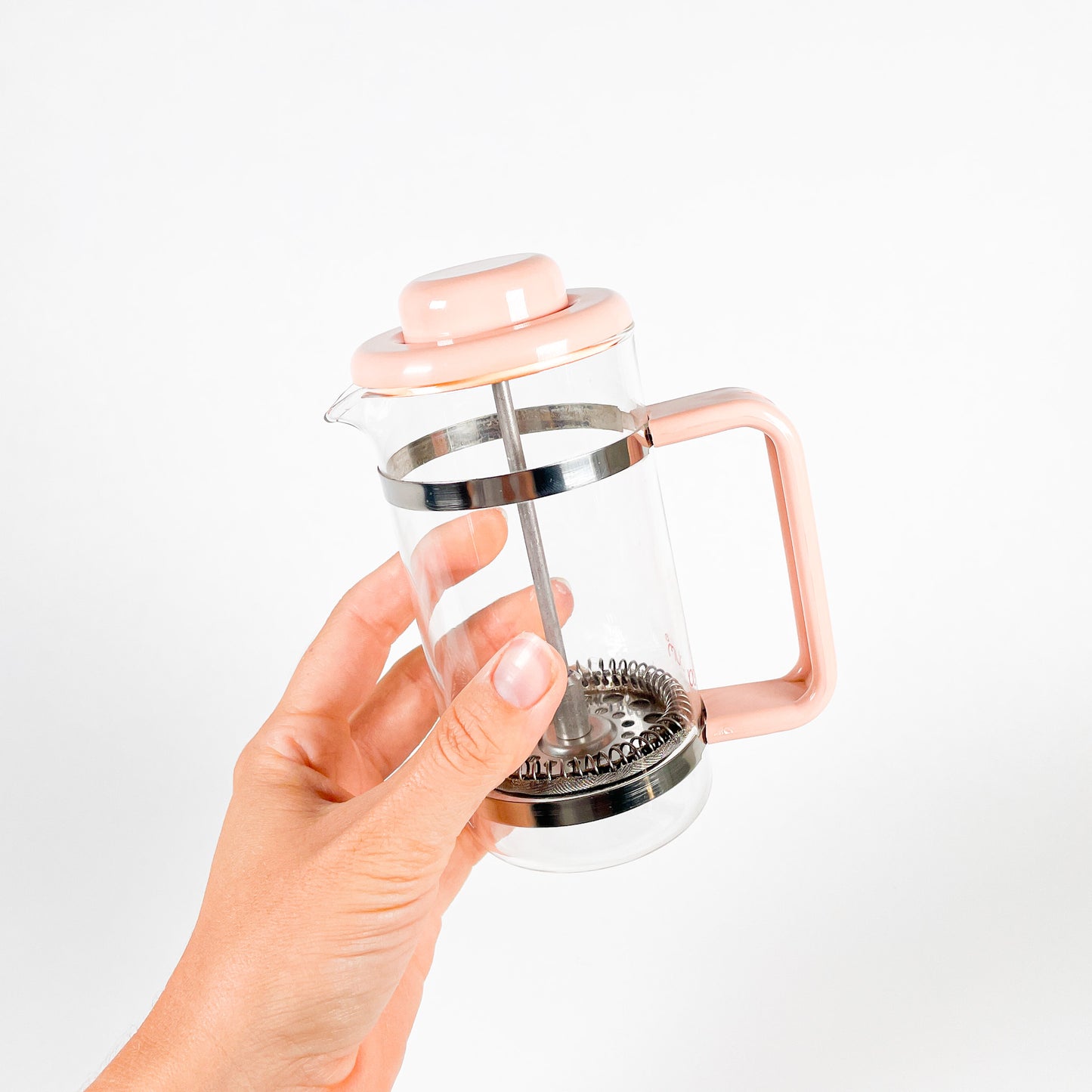 Small pink Bodum french press coffee maker