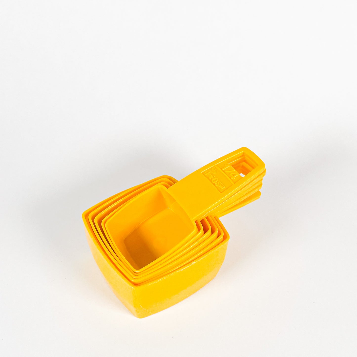 Yellow Frig-O-Seal measuring cups