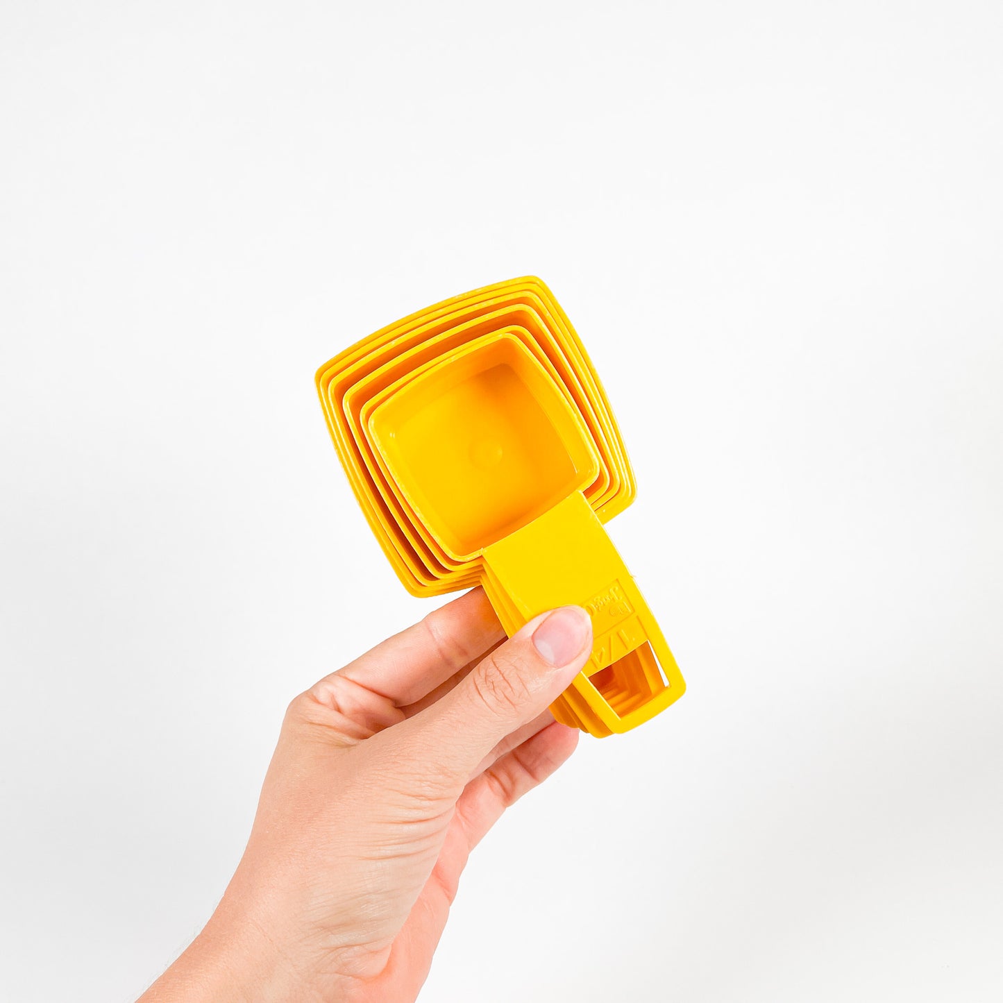 Yellow Frig-O-Seal measuring cups