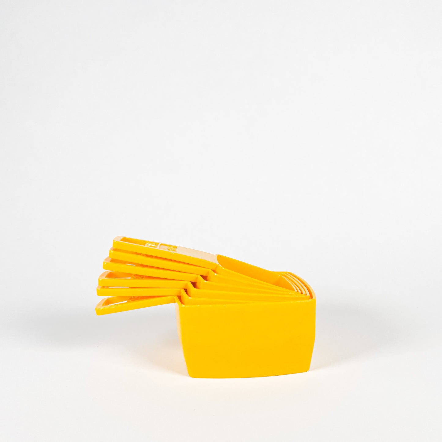 Yellow Frig-O-Seal measuring cups