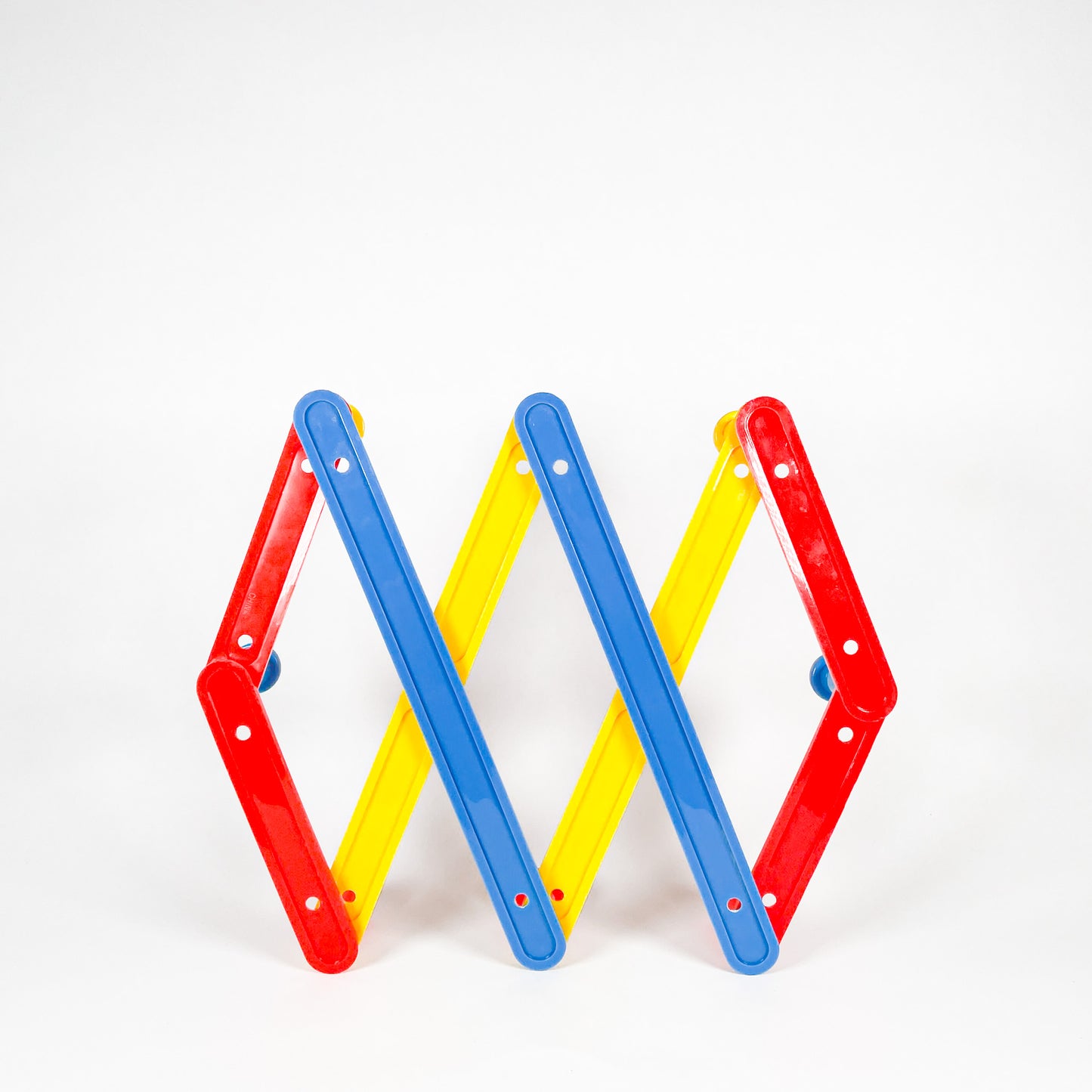 Primary colors plastic accordion rack