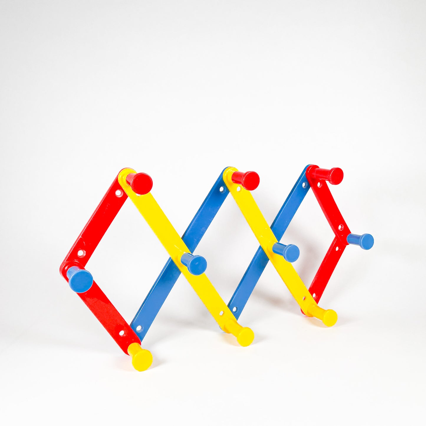 Primary colors plastic accordion rack