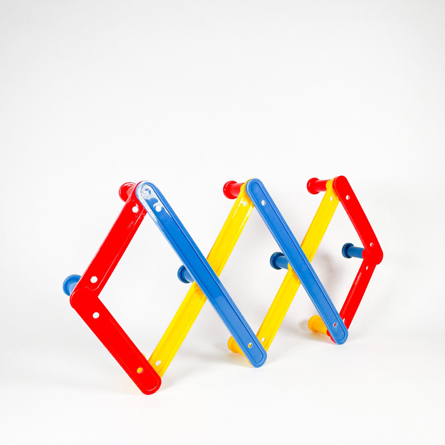 Primary colors plastic accordion rack