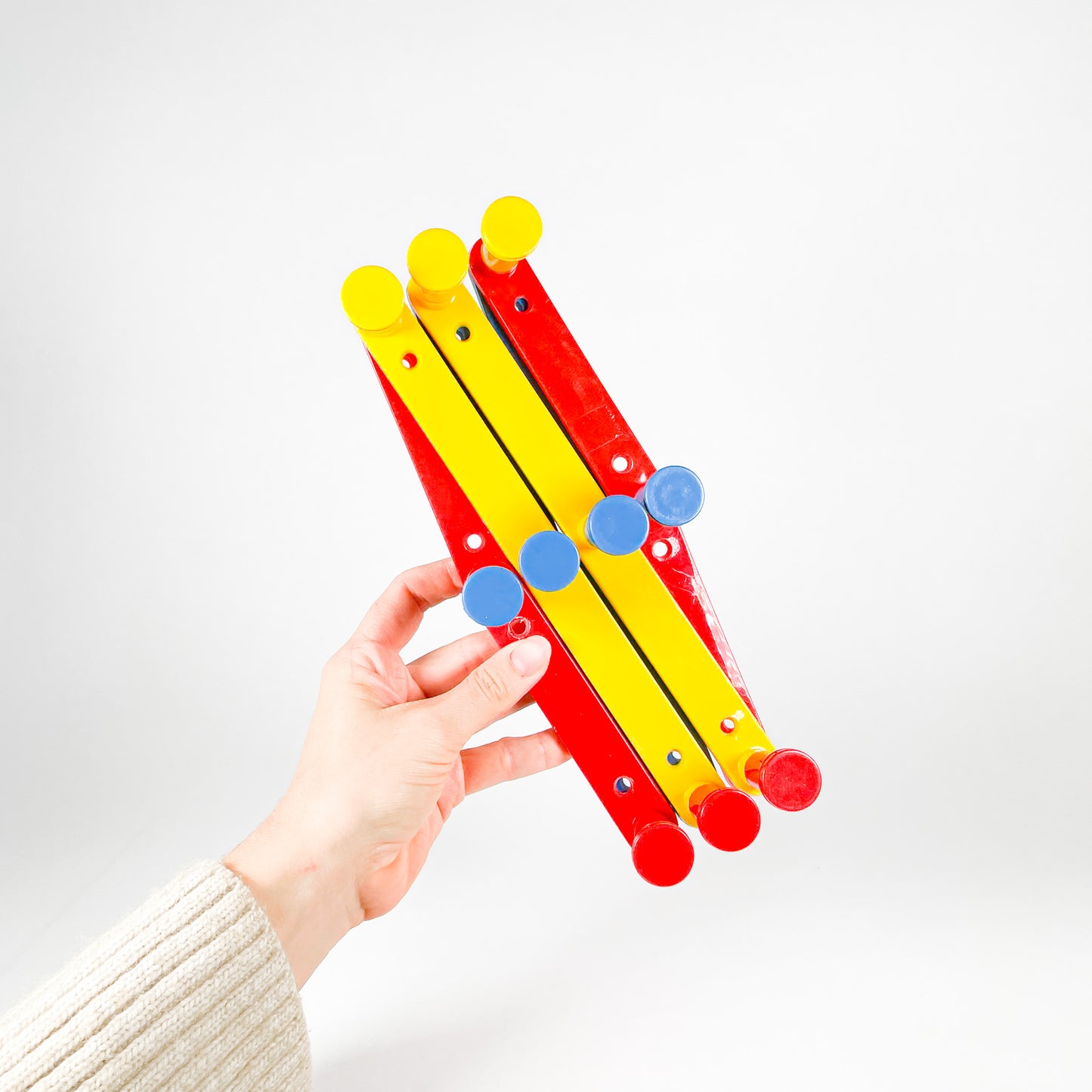 Primary colors plastic accordion rack