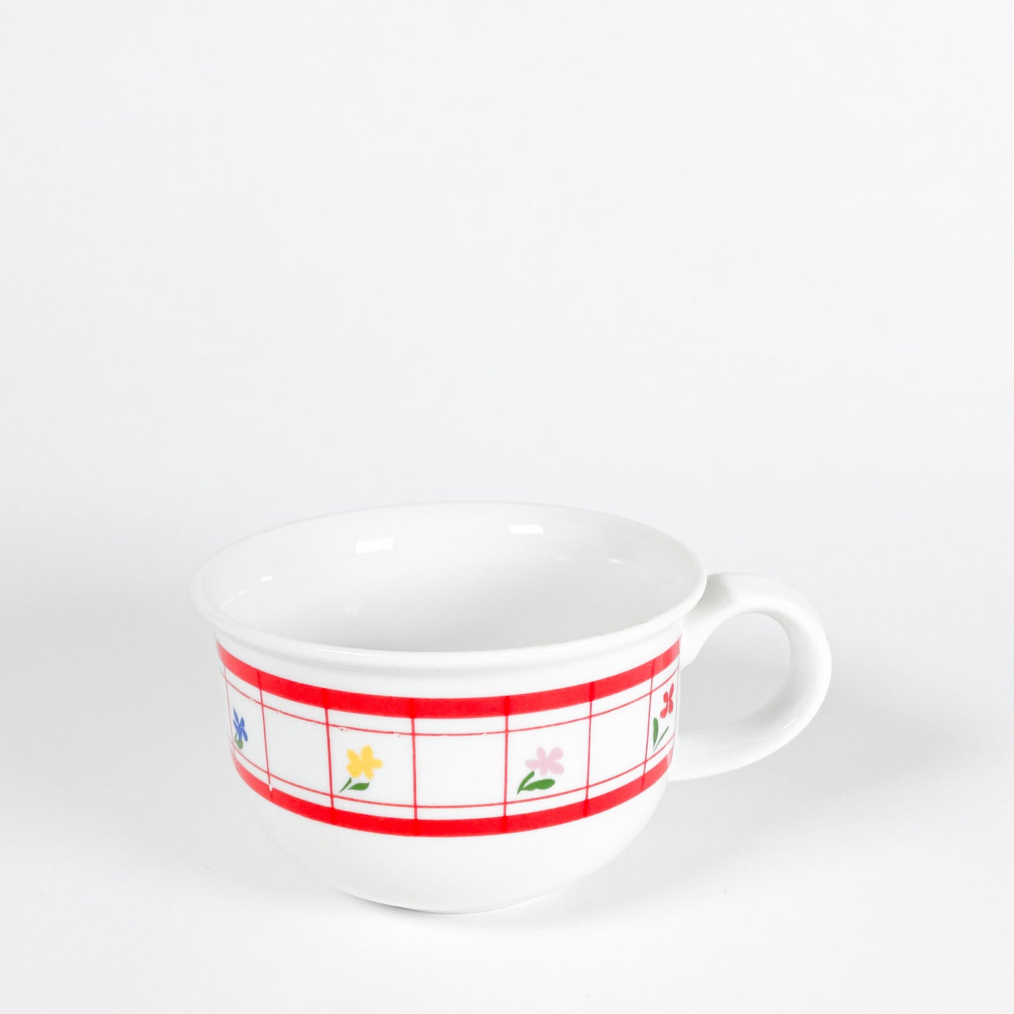 Red checkered mug with small flowers