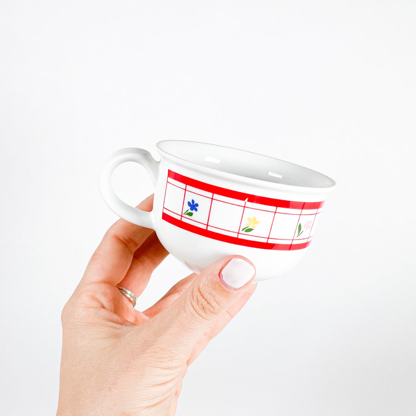 Red checkered mug with small flowers