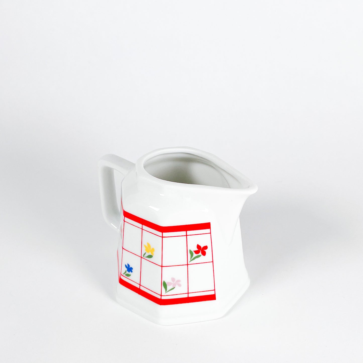 Red checkered creamer with small flowers