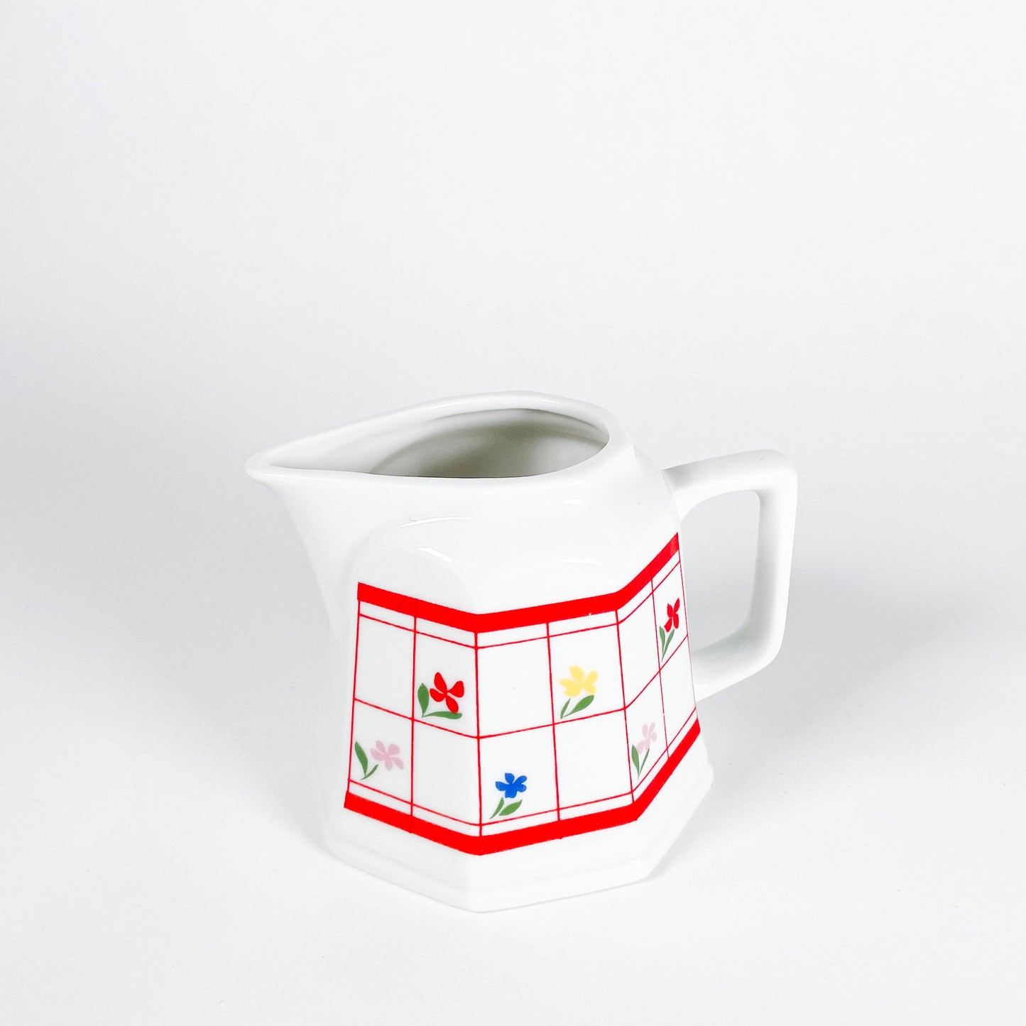 Red checkered creamer with small flowers
