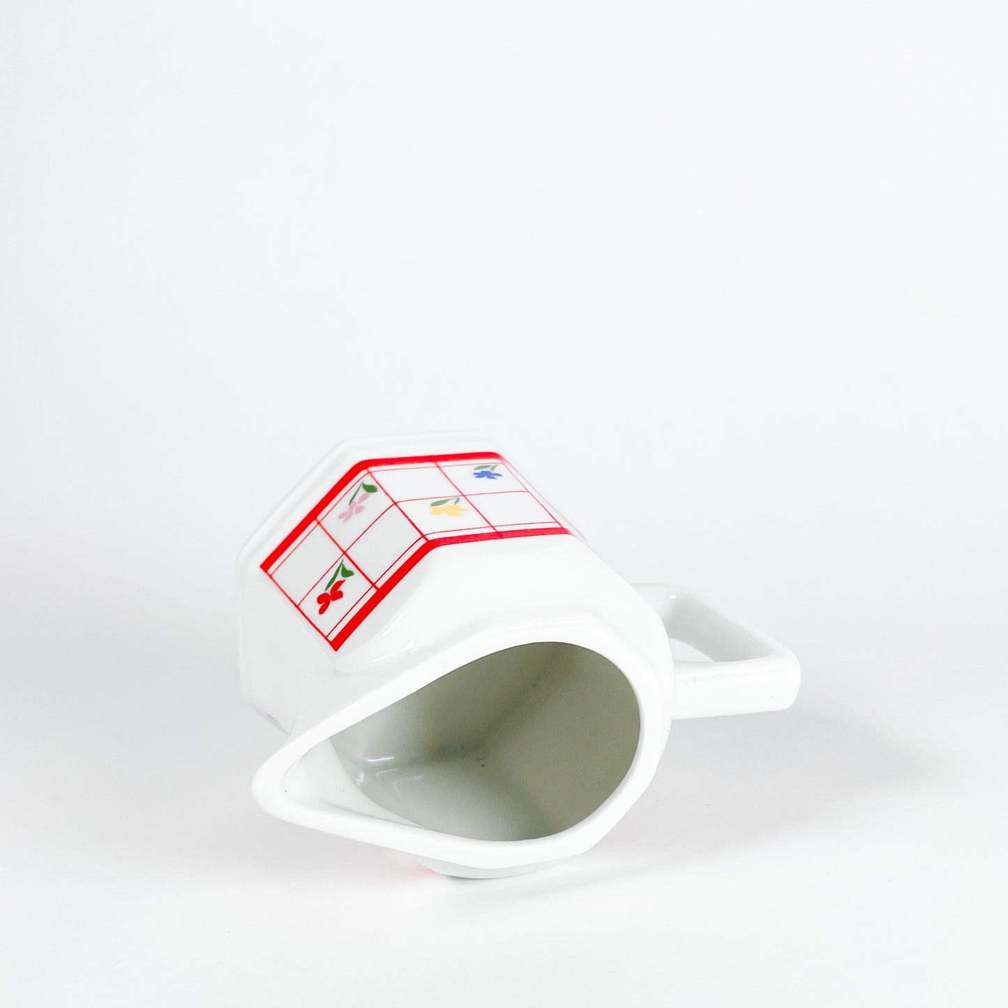 Red checkered creamer with small flowers