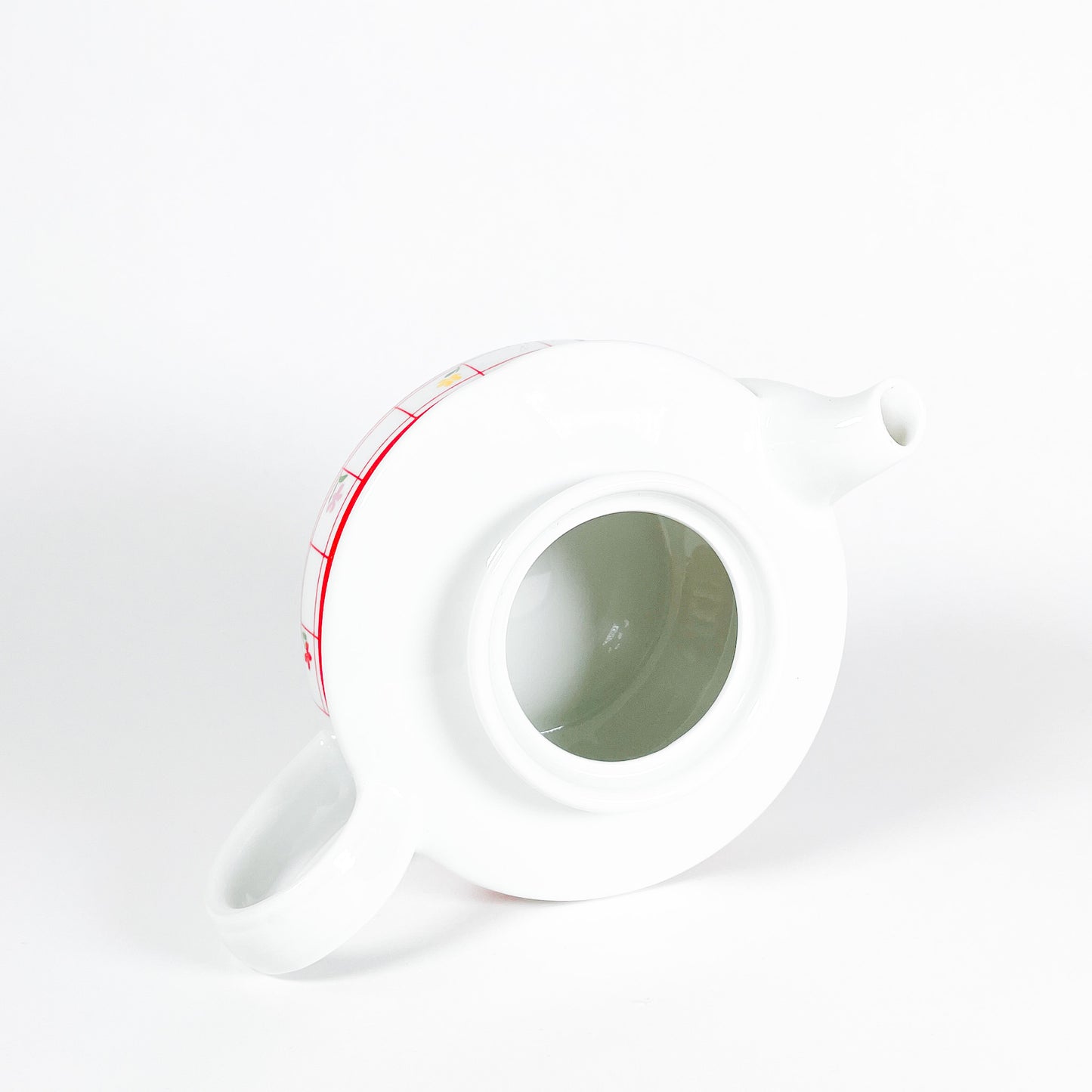 Red checkered teapot with small flowers