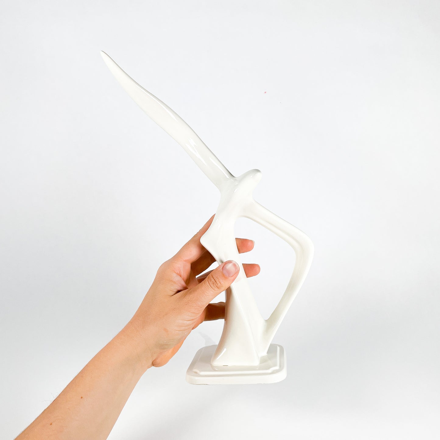 White ceramic bird statue