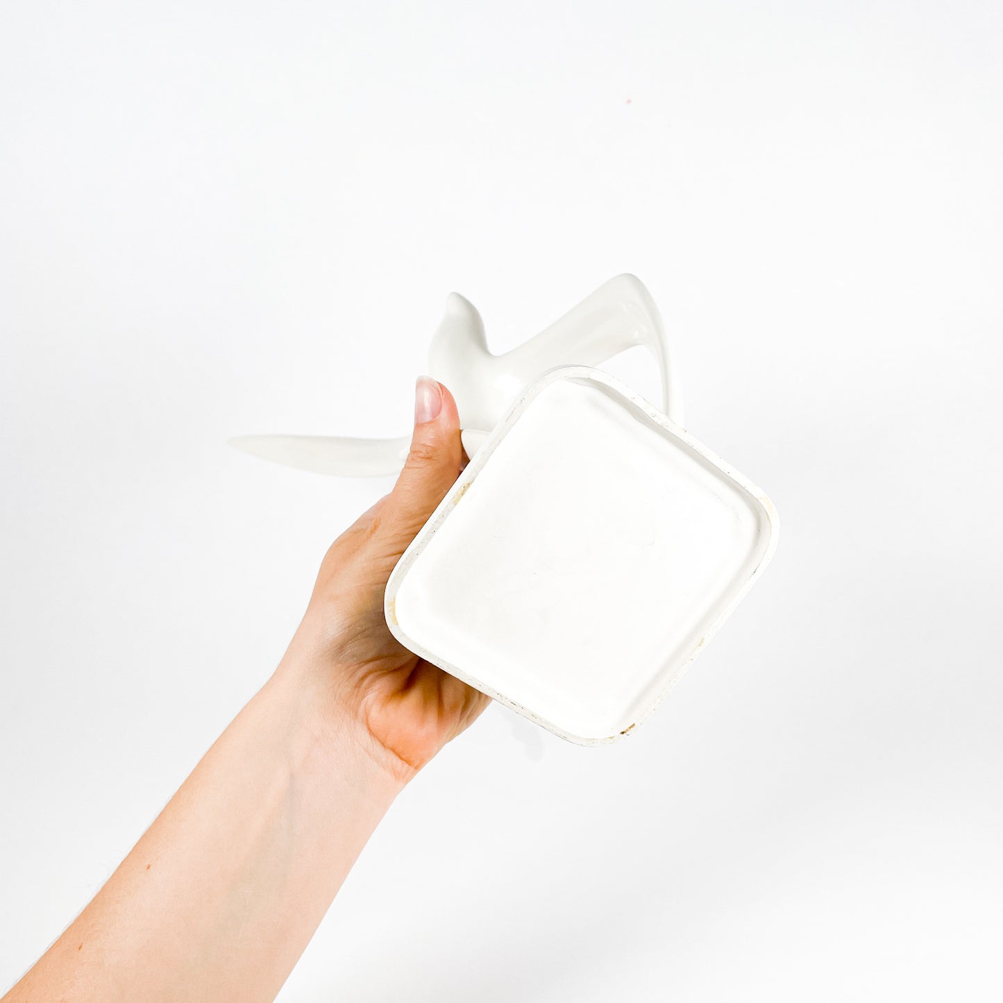 White ceramic bird statue