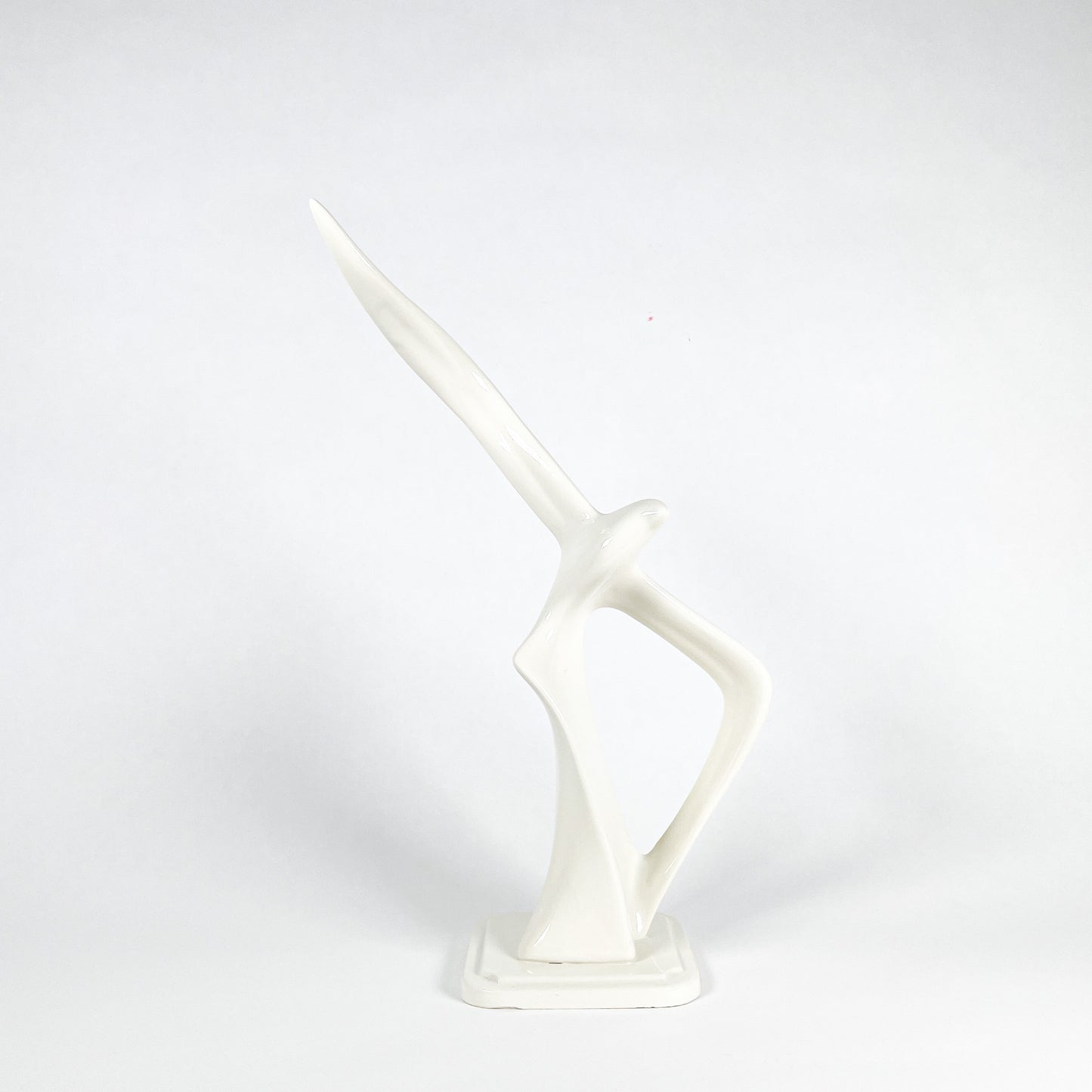 White ceramic bird statue