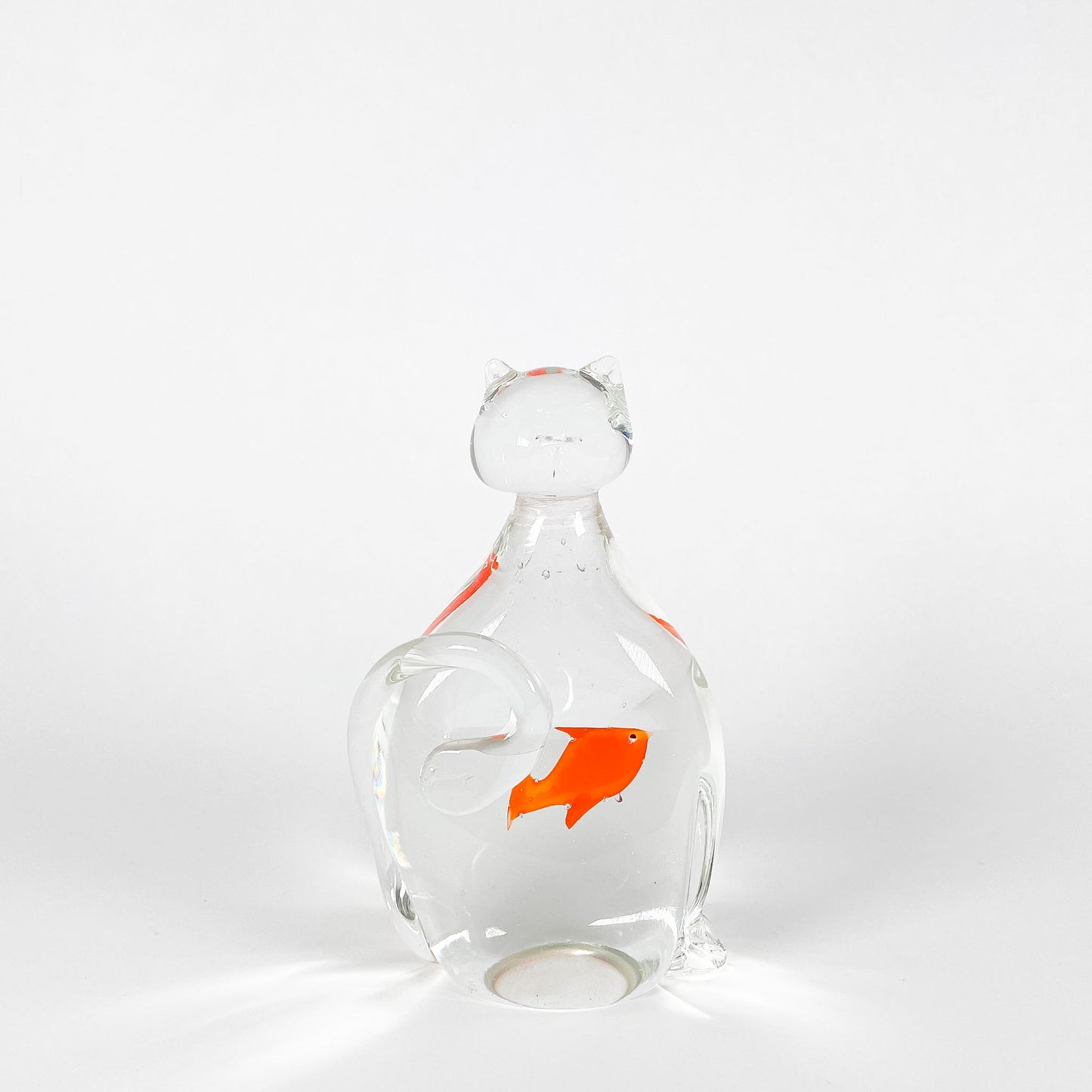 Transparent blown glass cat with goldfish