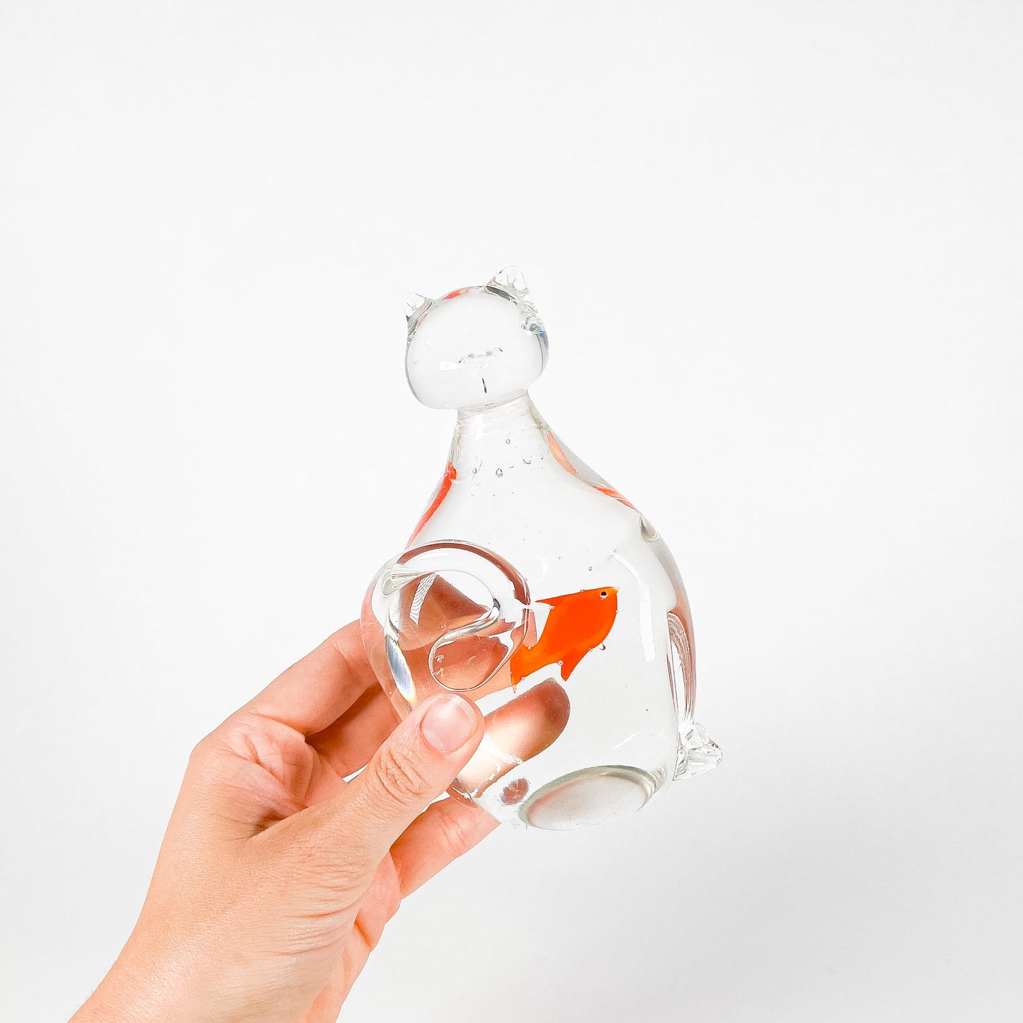 Transparent blown glass cat with goldfish