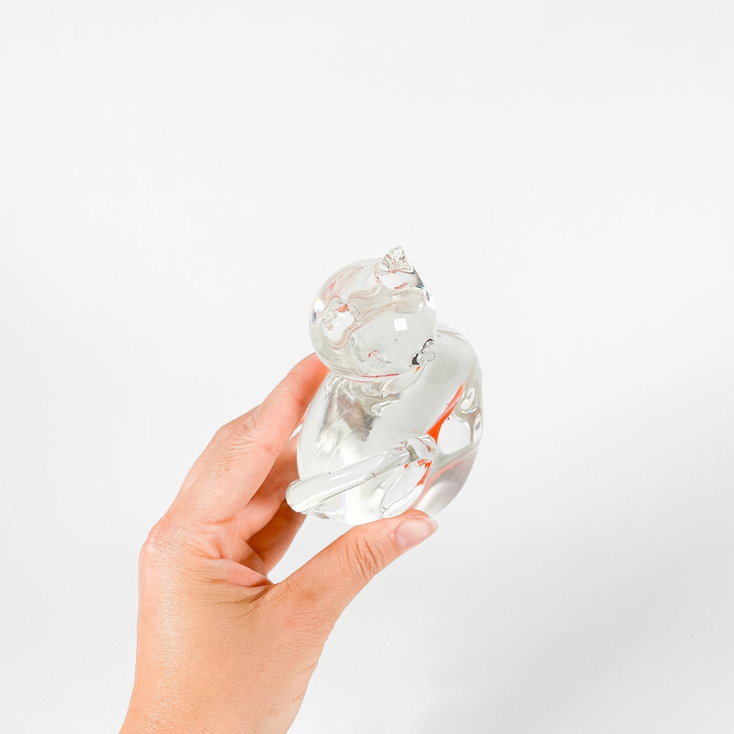 Transparent blown glass cat with goldfish