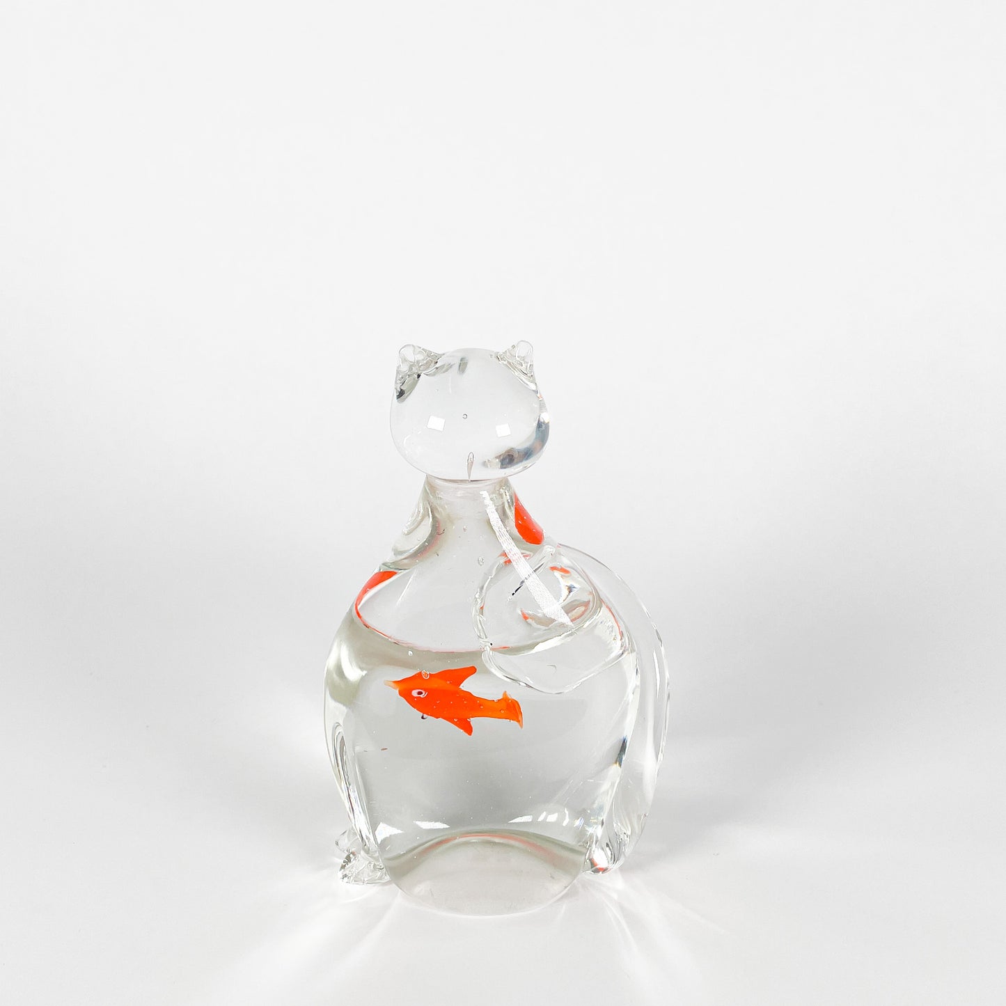 Transparent blown glass cat with goldfish