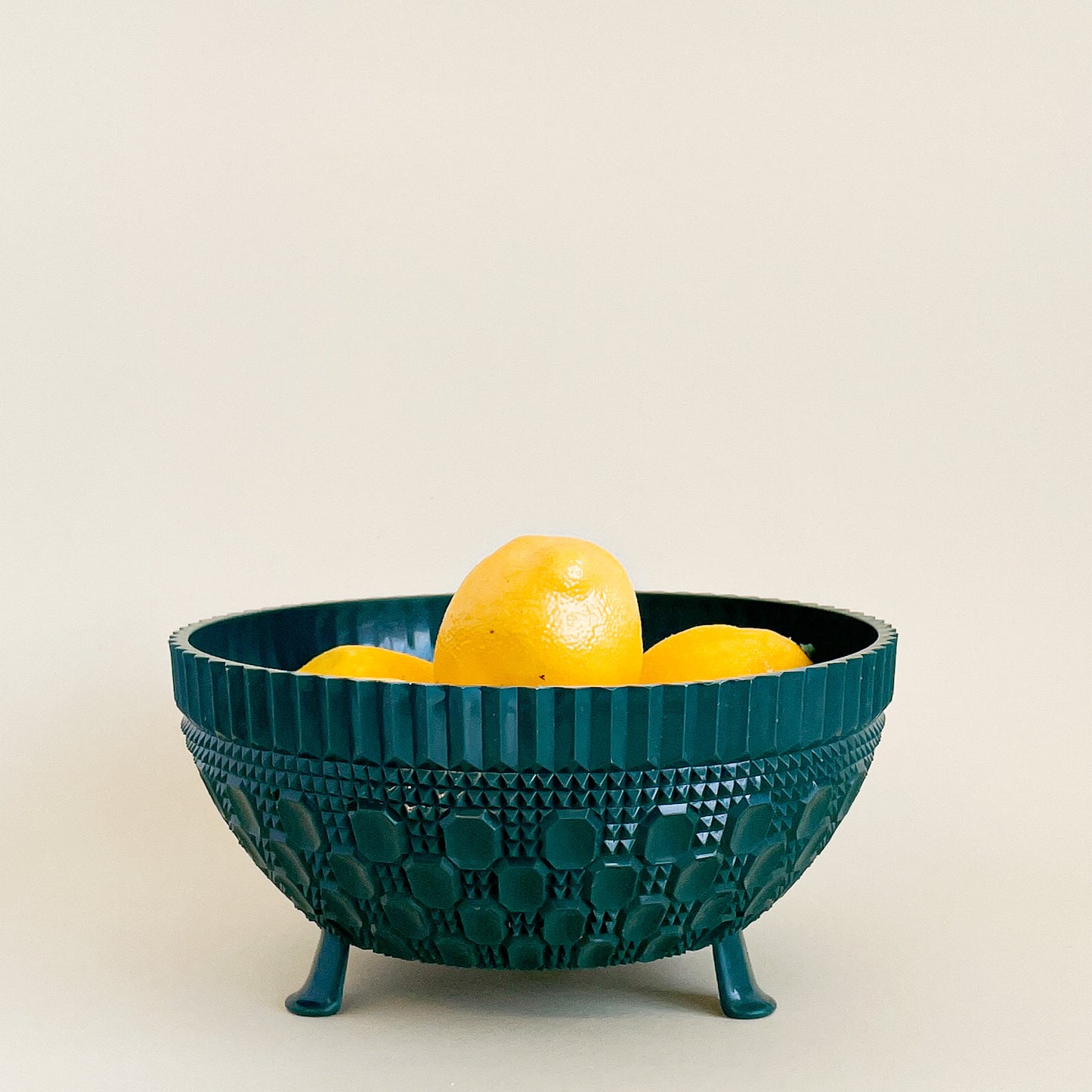 Green plastic fruit bowl