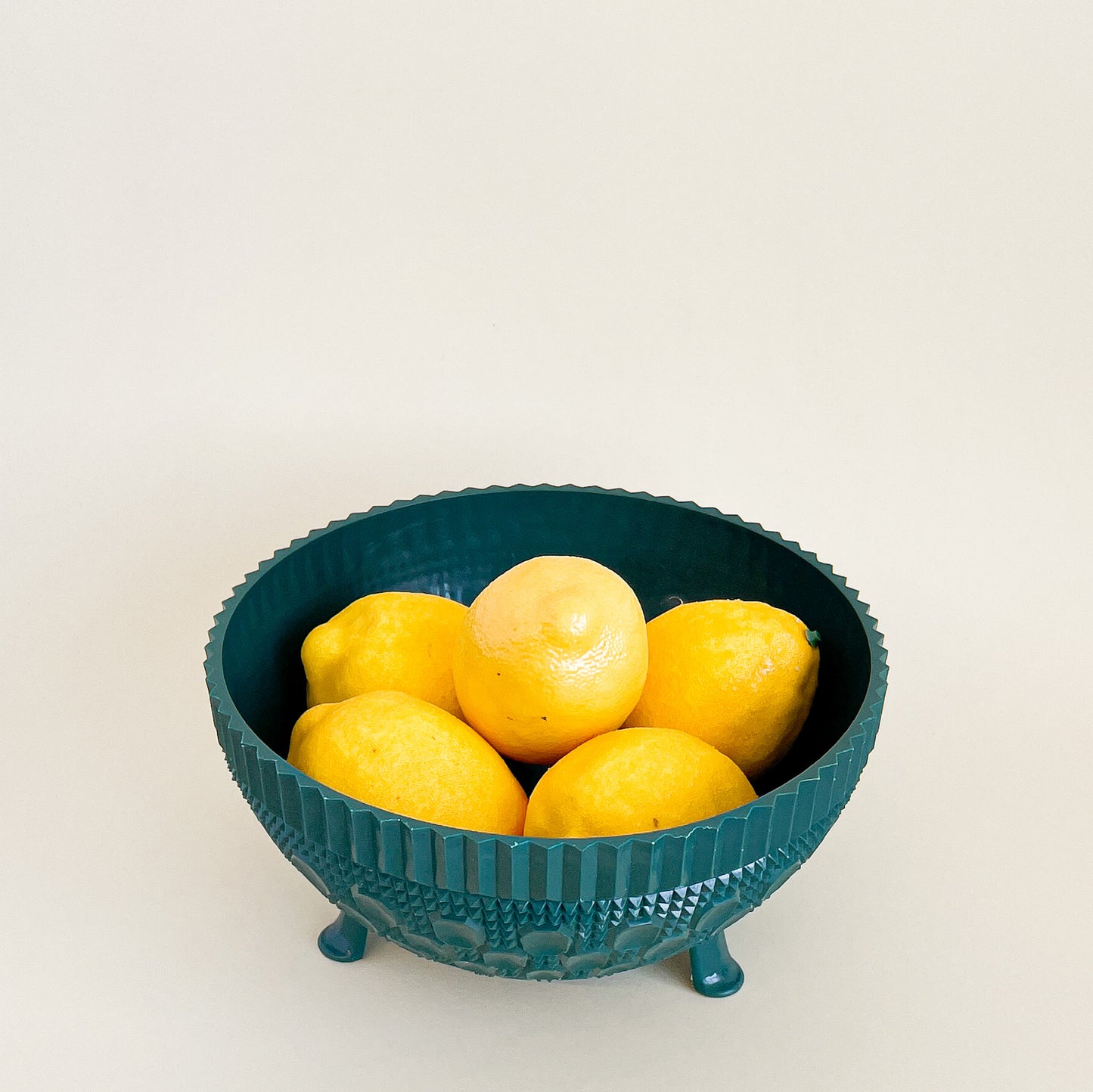 Green plastic fruit bowl