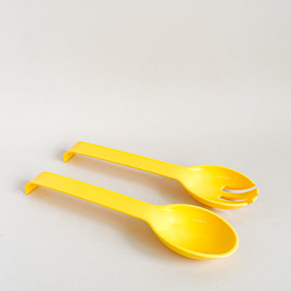 Yellow salad utensils