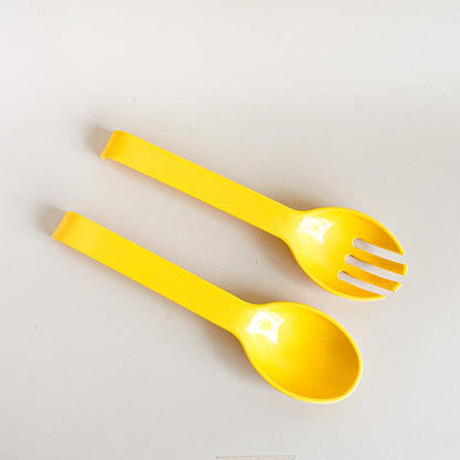 Yellow salad utensils