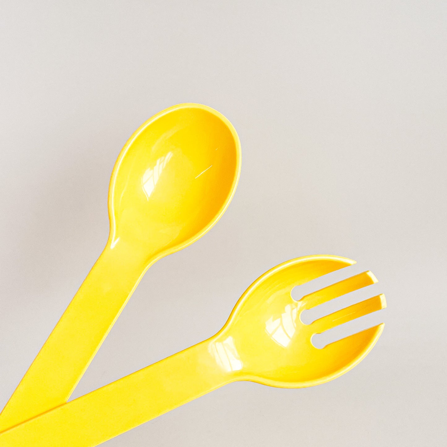 Yellow salad utensils