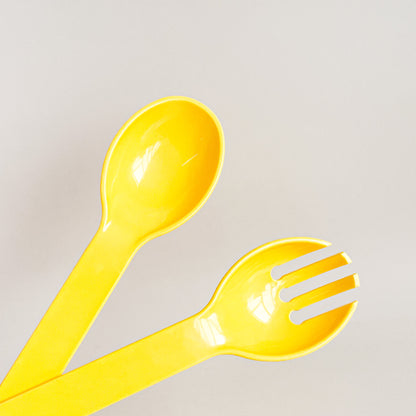 Yellow salad utensils