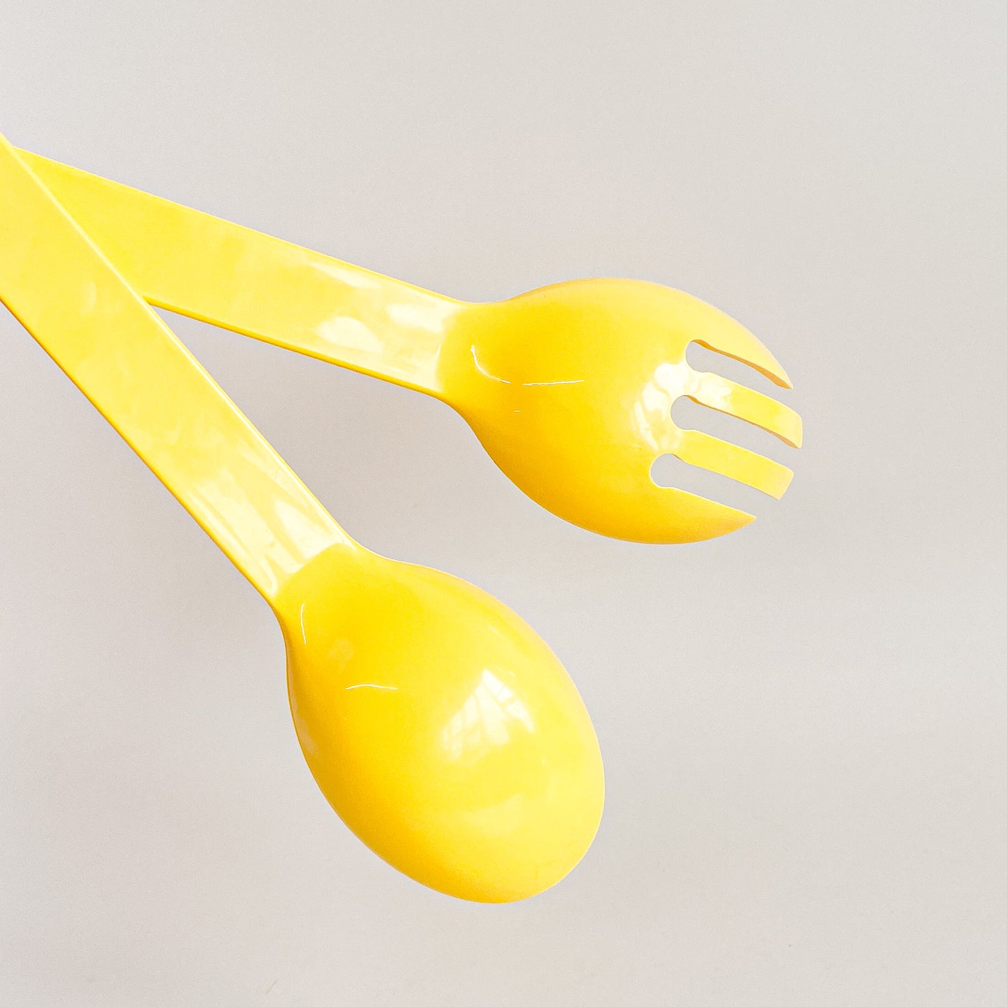 Yellow salad utensils