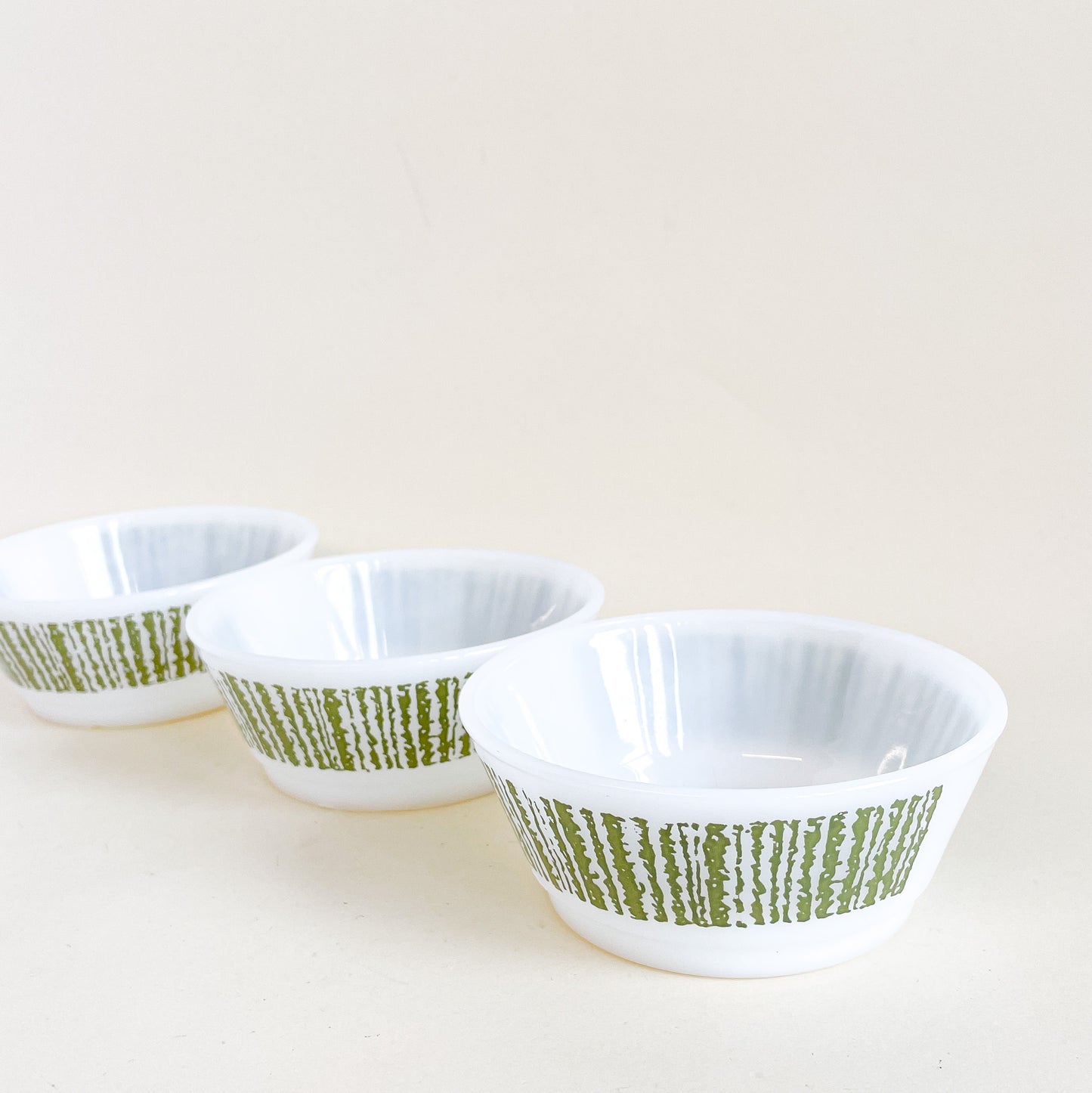 Trio of white and green Fire-King bowls