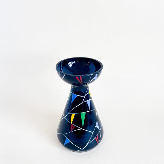 Black vase with colored triangles