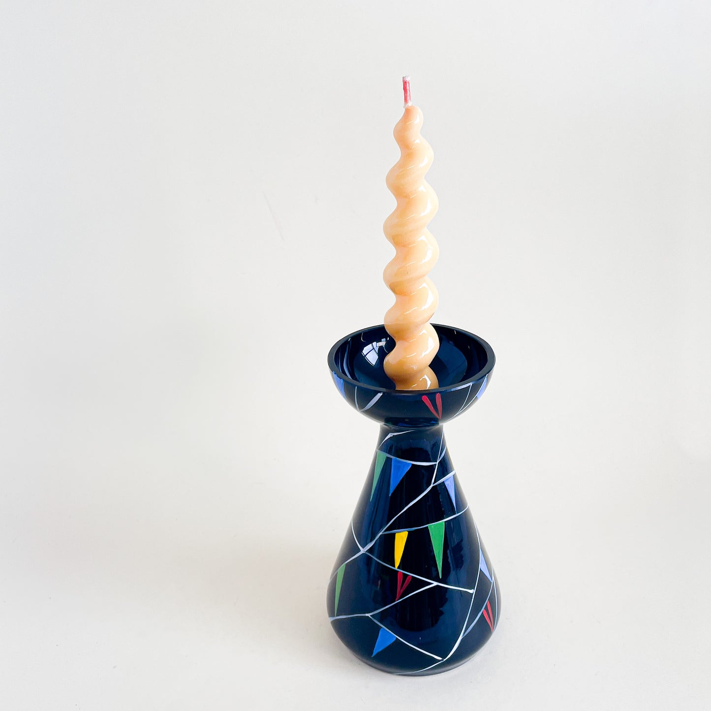 Black vase with colored triangles