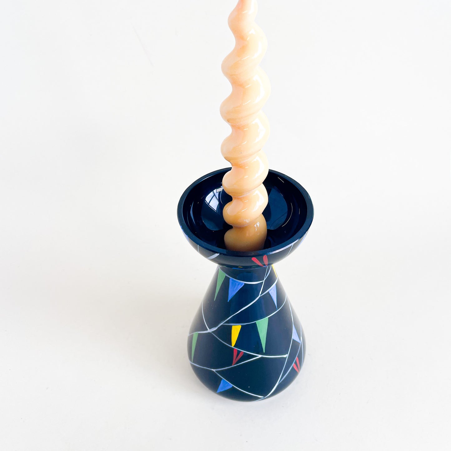 Black vase with colored triangles