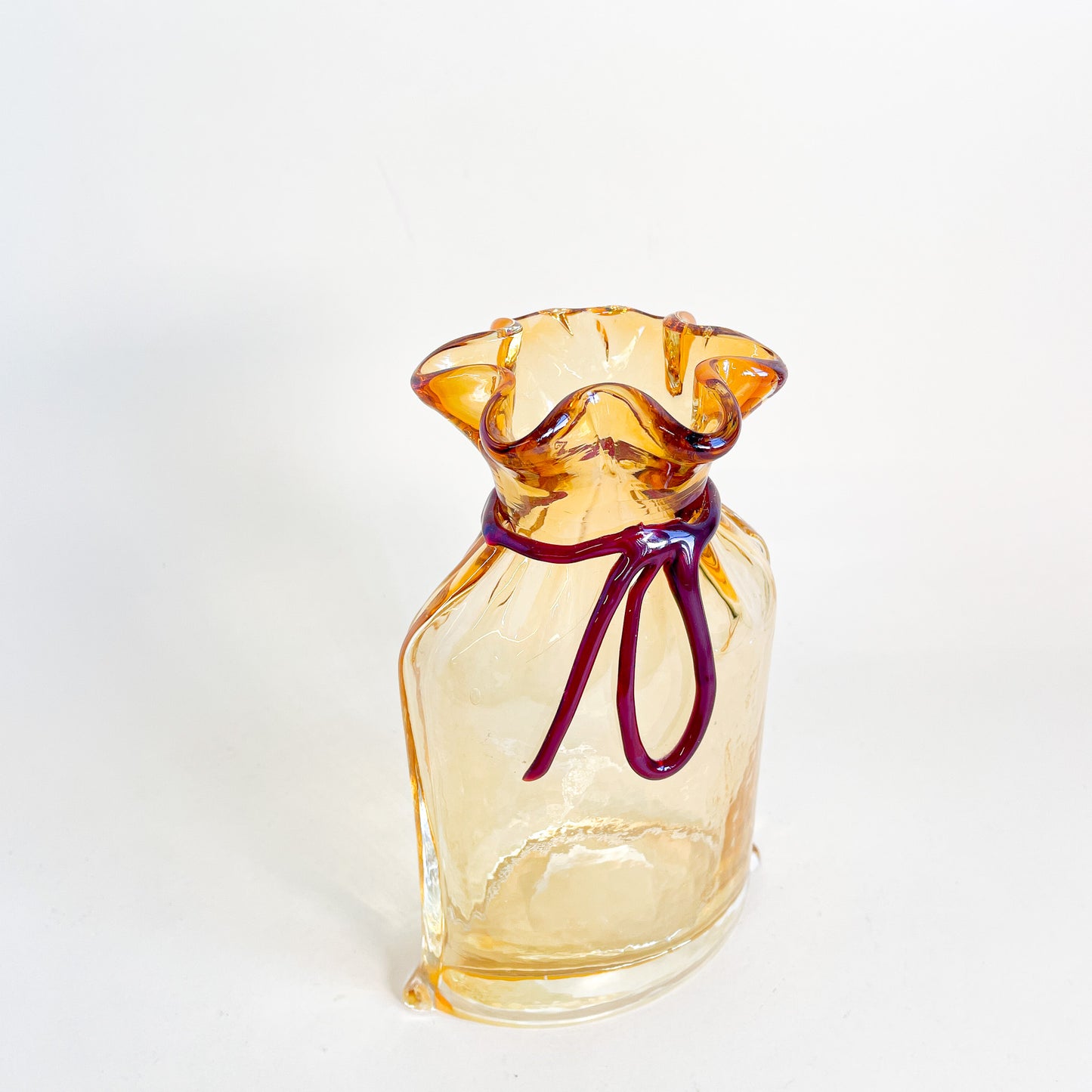 Amber blown glass bag/vase