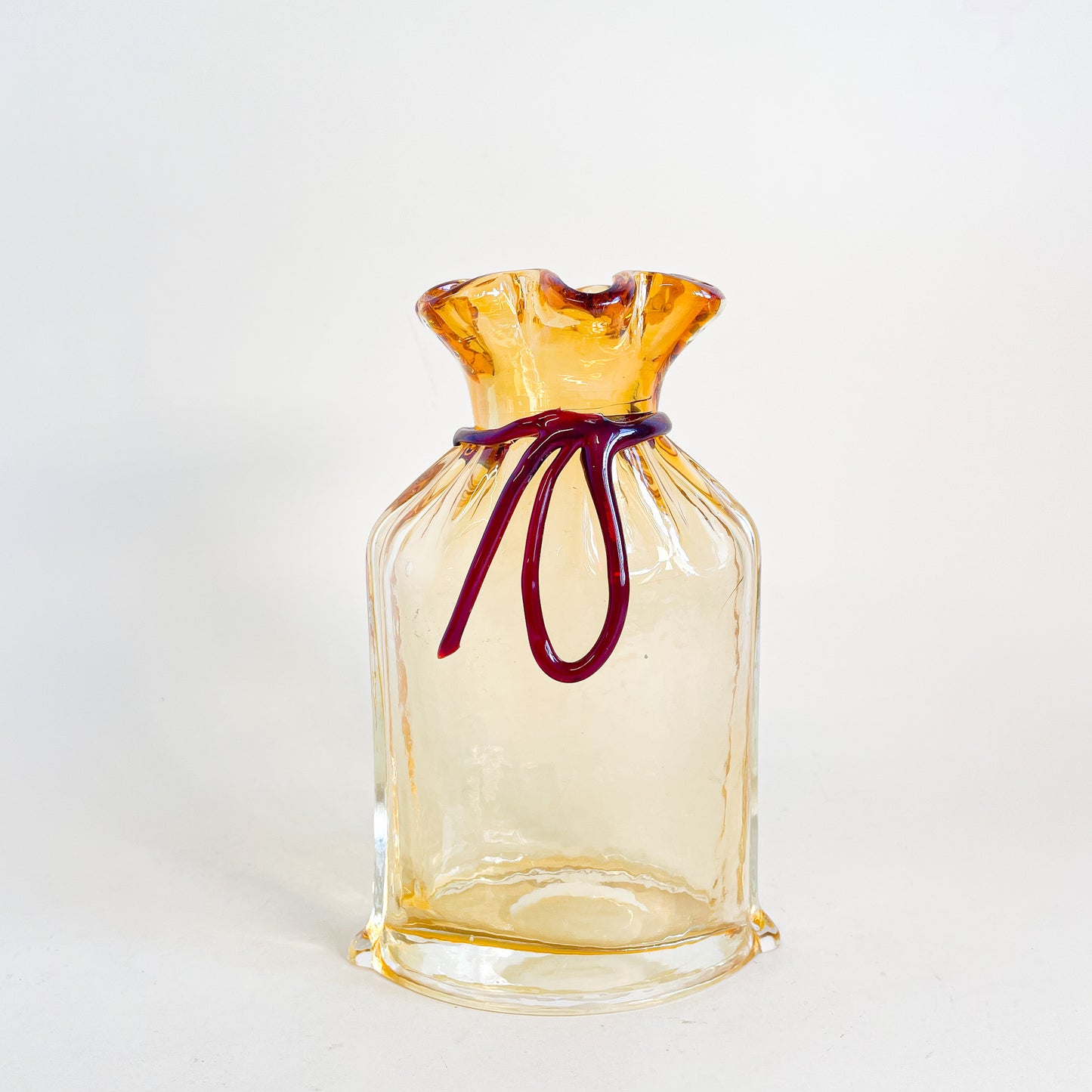 Amber blown glass bag/vase