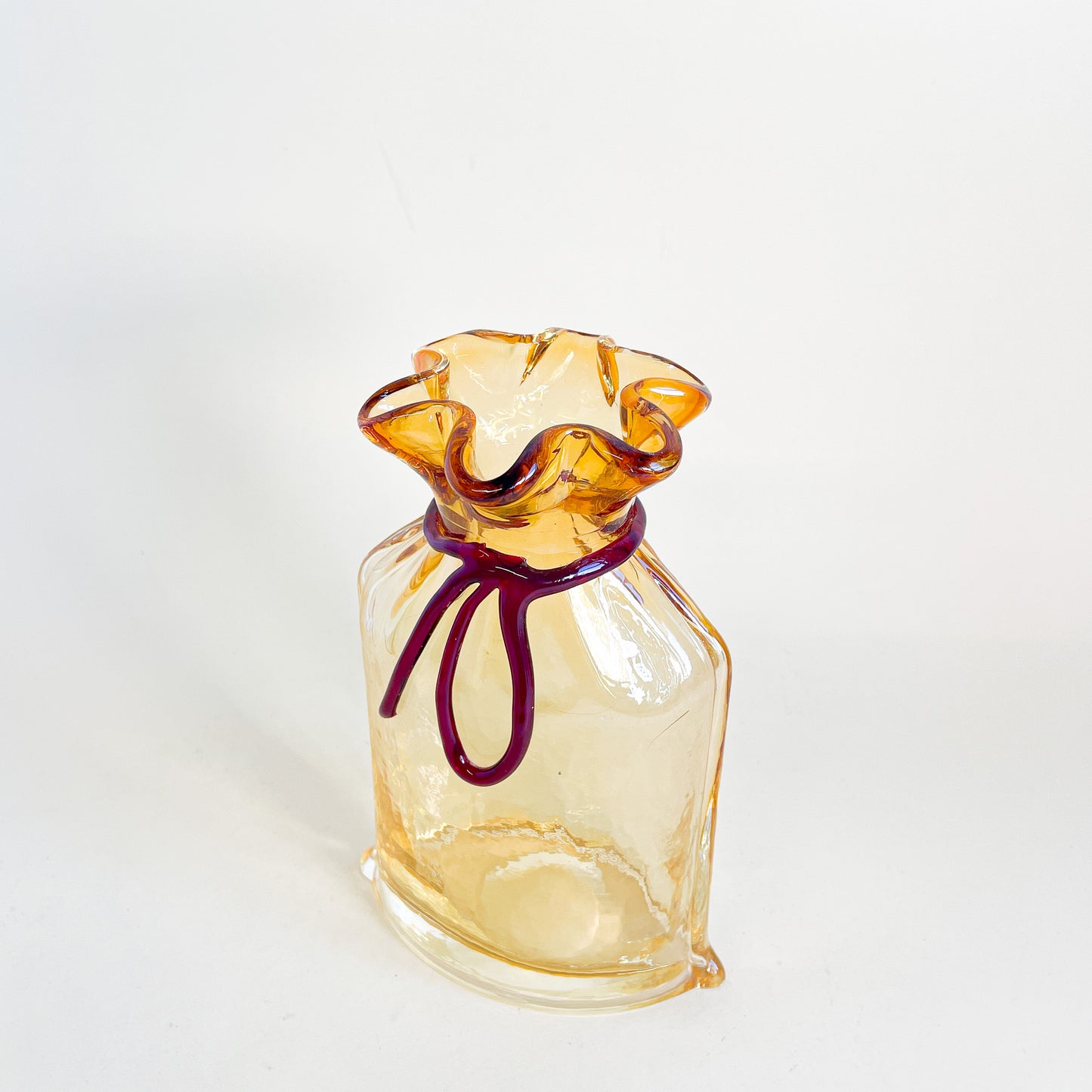 Amber blown glass bag/vase