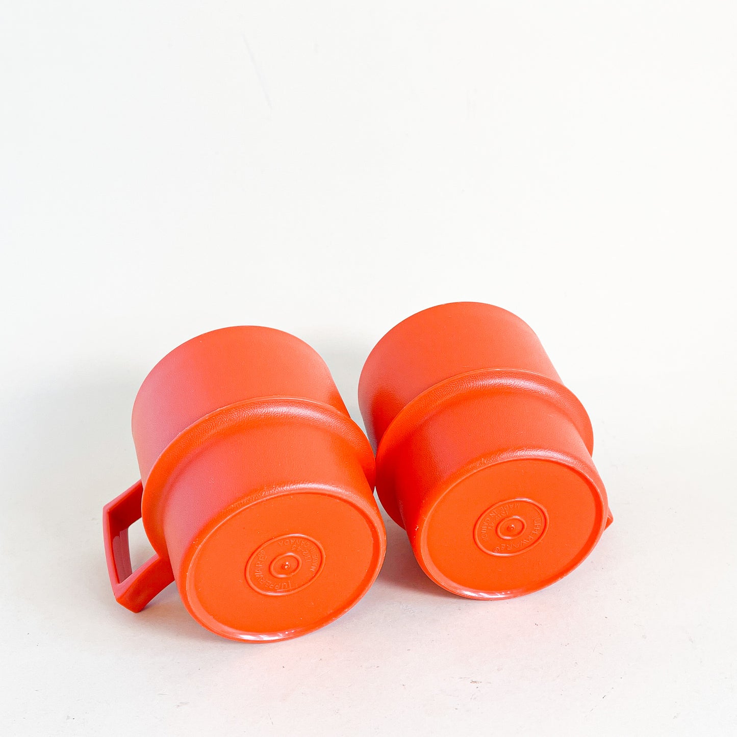 Orange Tupperware mug duo