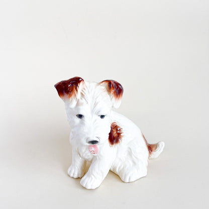 White and brown ceramic dog