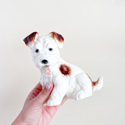 White and brown ceramic dog