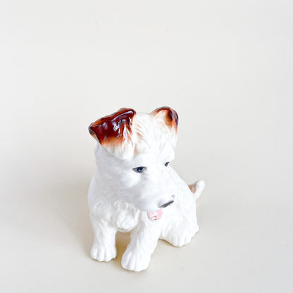 White and brown ceramic dog