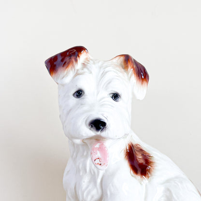 White and brown ceramic dog