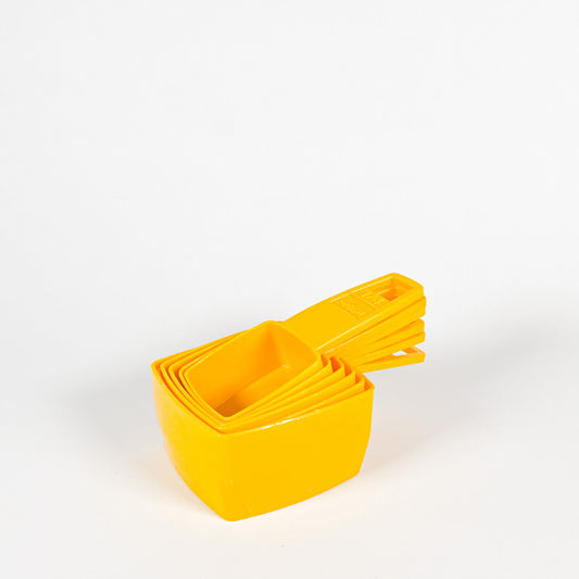 Yellow Frig-O-Seal measuring cups