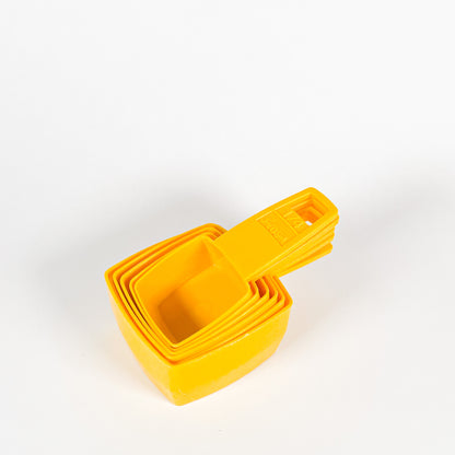 Yellow Frig-O-Seal measuring cups 