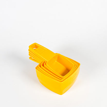 Yellow Frig-O-Seal measuring cups 