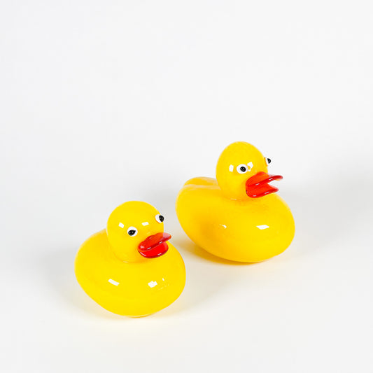 Yellow blown glass ducks