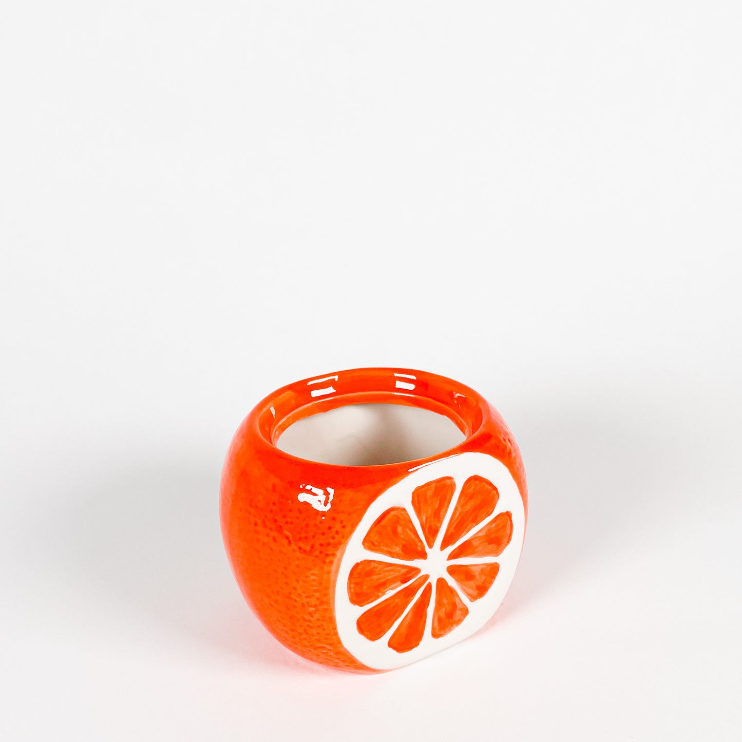 Small orange ceramic pot