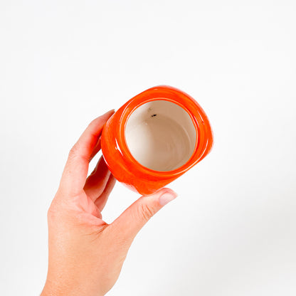 Small orange ceramic pot