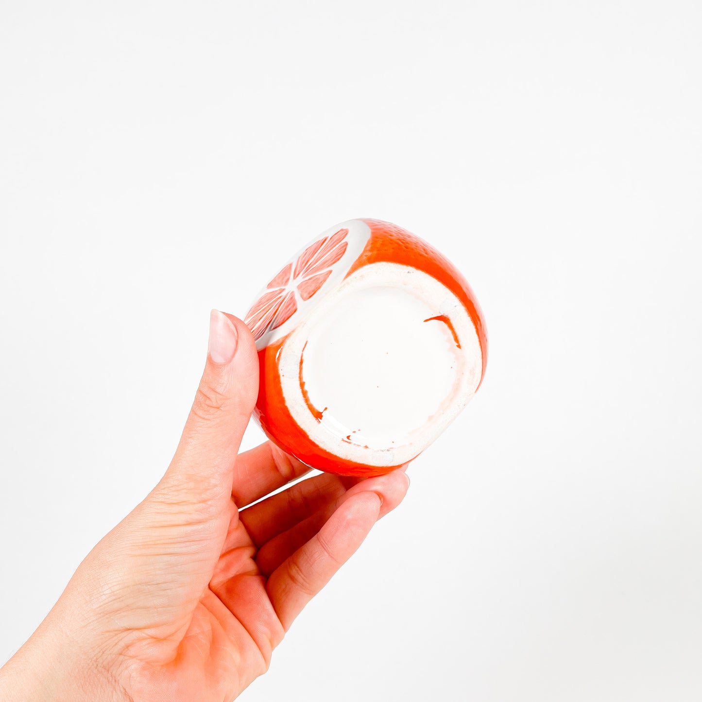 Small orange ceramic pot