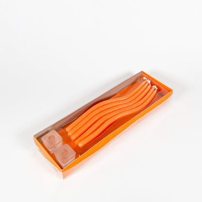 Thin orange squiggly taper candles