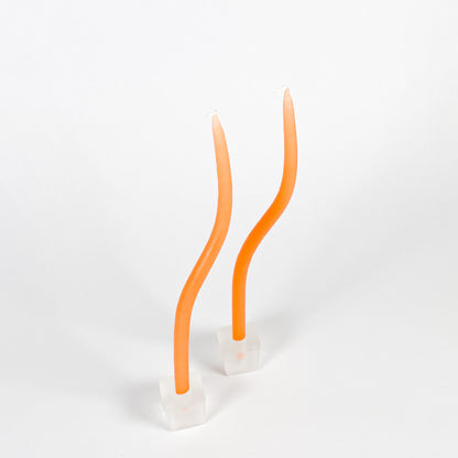 Thin orange squiggly taper candles